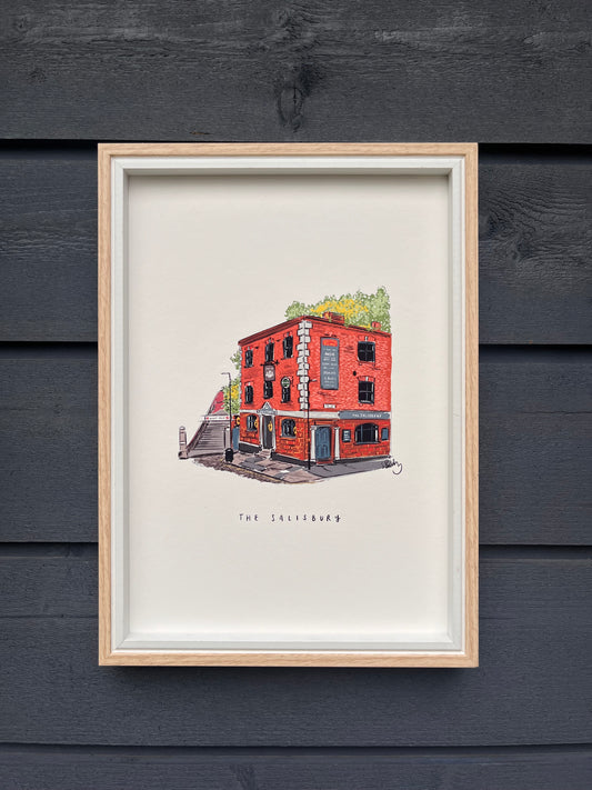 Salisbury venue in Manchester art print, framed in a light wooden frame hung on a wooden dark grey panelled wall 