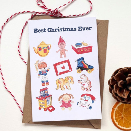 White Best Christmas Ever card and accompanying brown envelope features 11 retro toys illustrated in colour